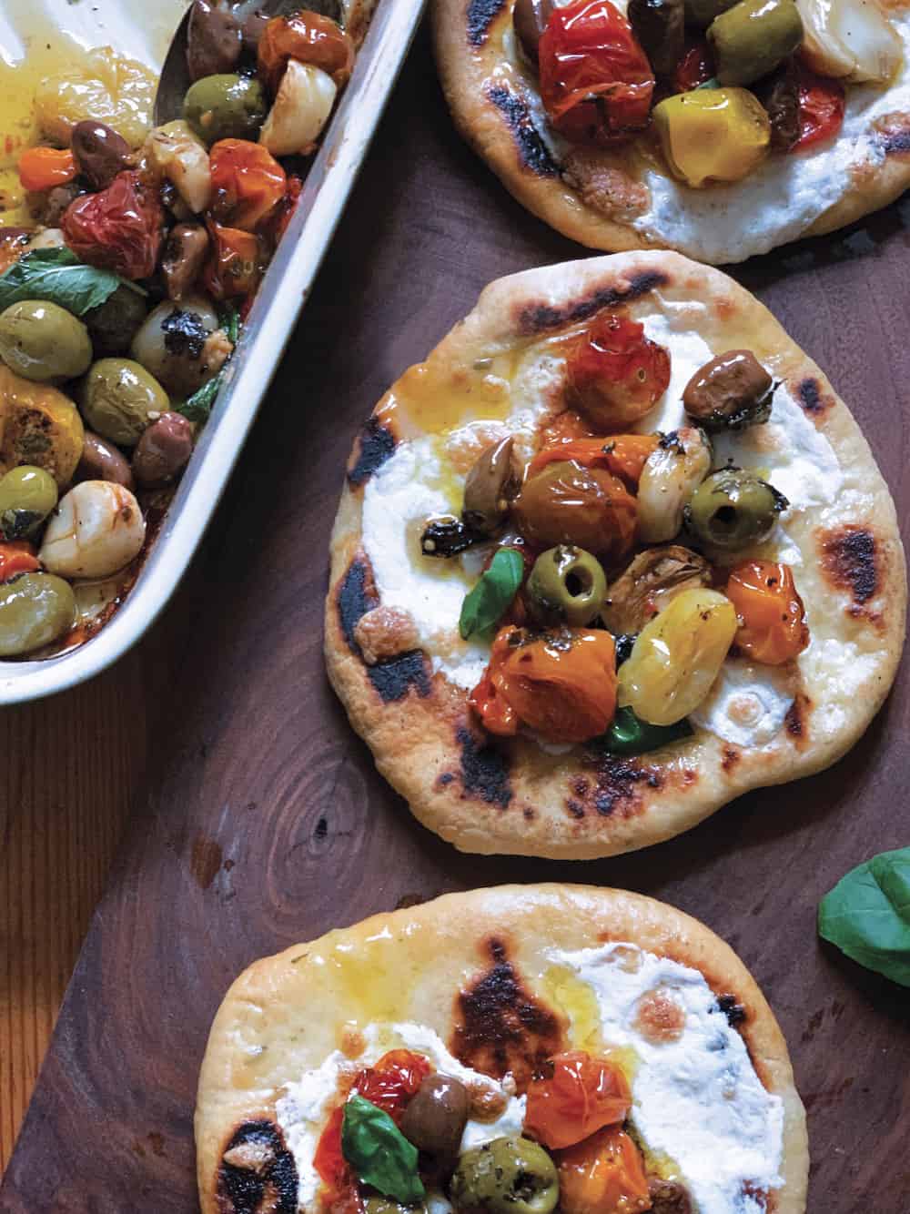 Roasted tomato & olives appetizer on a pita bread.