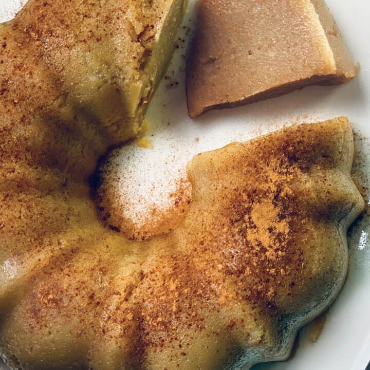 A Greek semolina cake with a piece cut out and another piece cut out.
