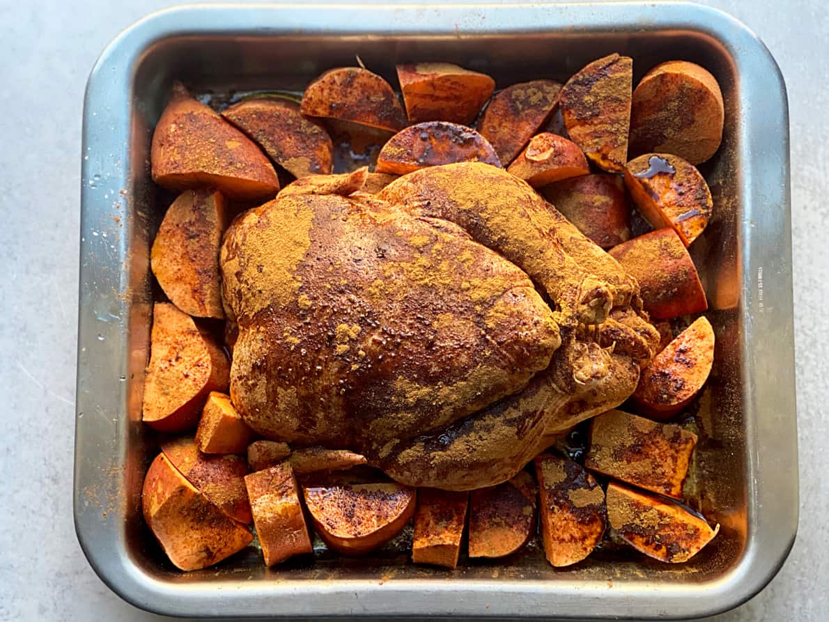 Chicken in a roasting pan.