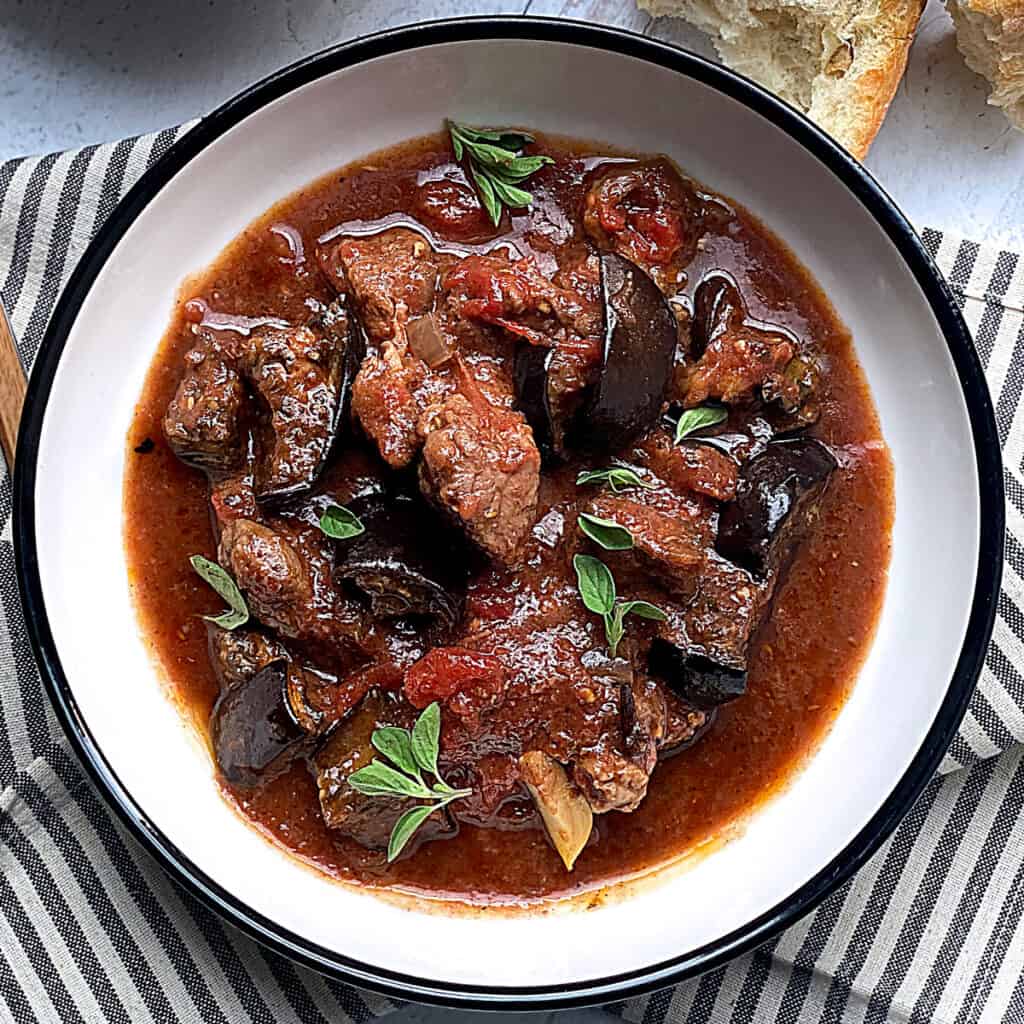 A bowl with eggplant stew.