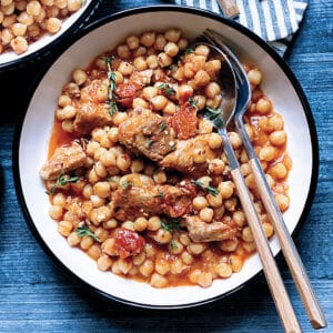 A plate with chickpea and pork stew.