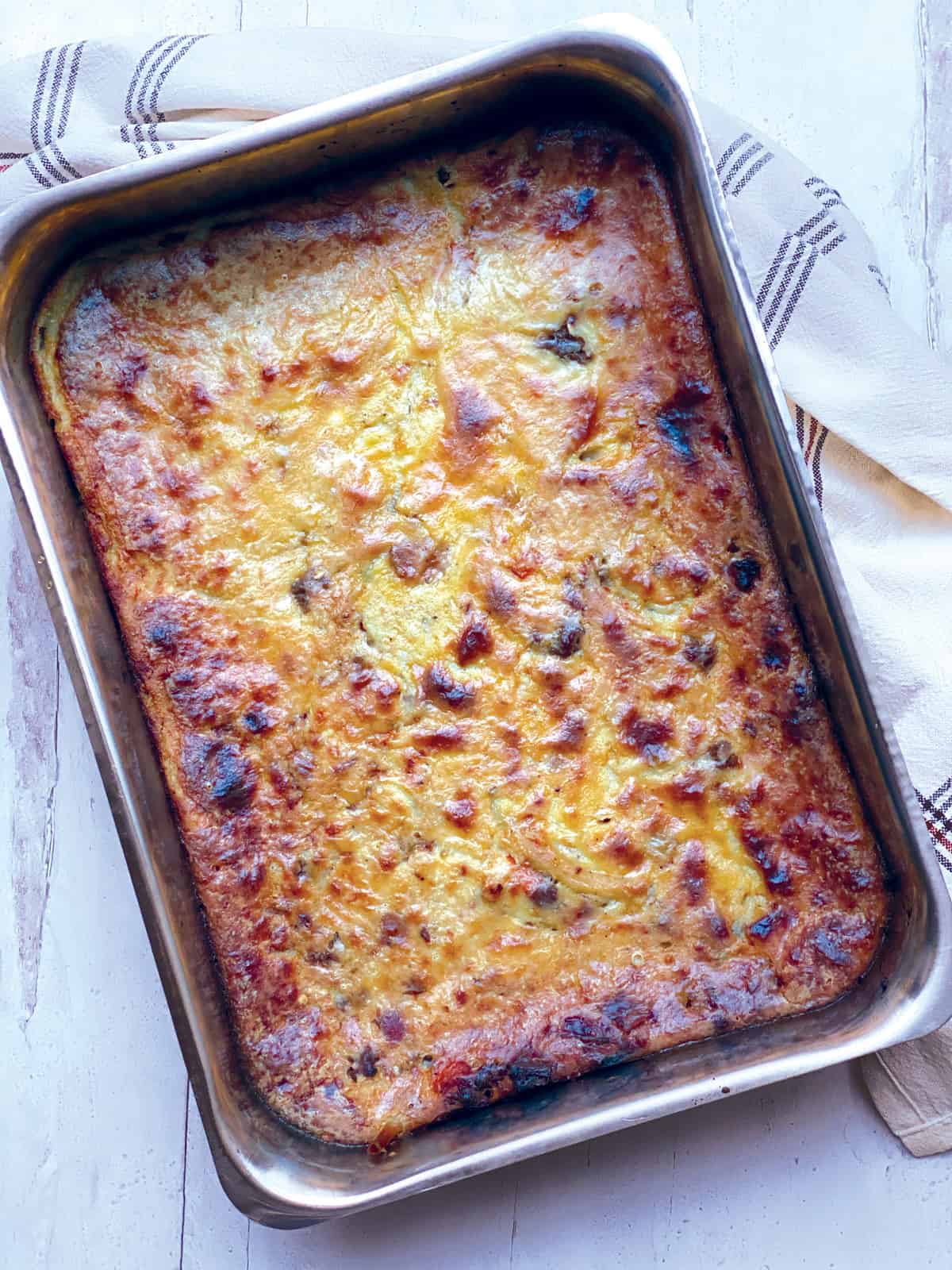 Baked Pastitsio-greek lasagna in a baking pan.