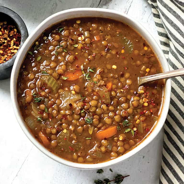 bowl of lentil soup and a spoon.