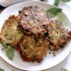 A plate with zucchini fritters.