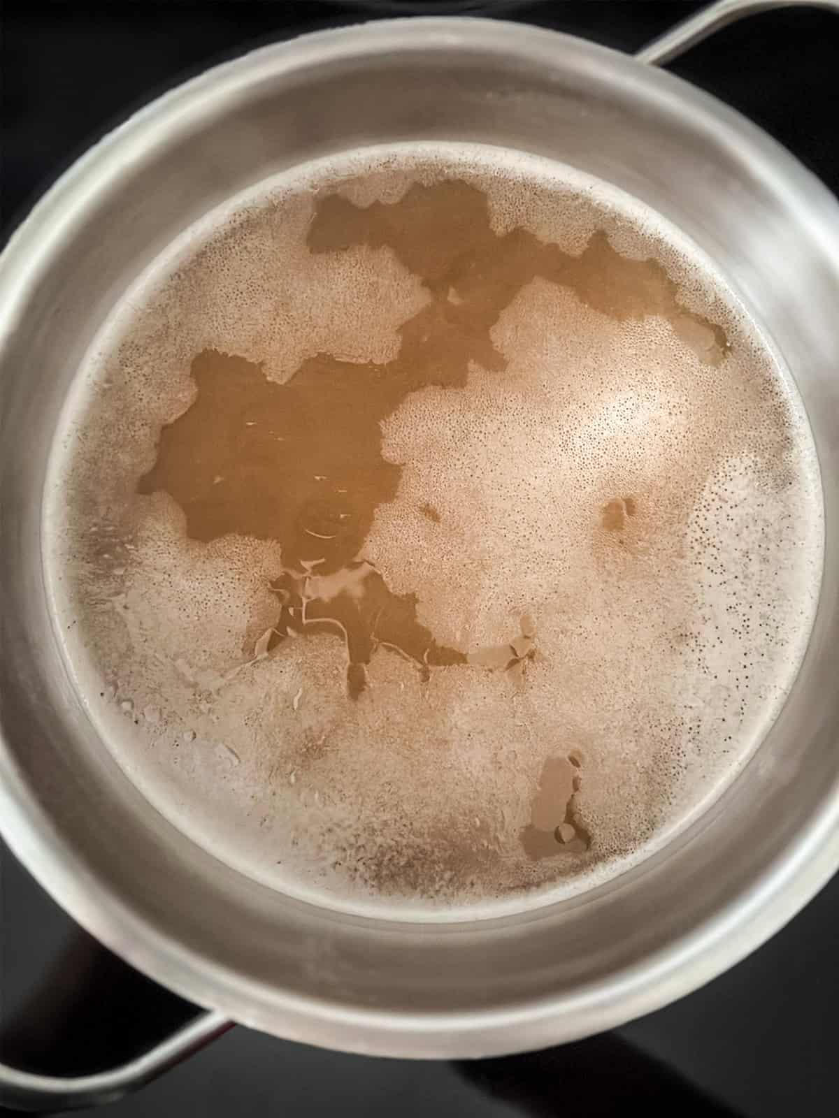 Broth simmering in a pot.