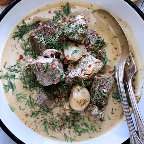 A plate with lamb stew avgolemono.