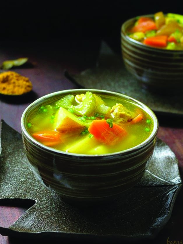 A bowl with chicken curry soup.