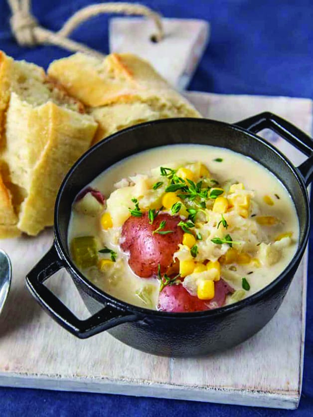 A bowl with fish chowder soup.