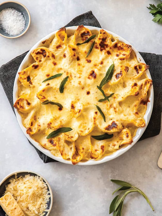 A casserole with pumpkin and ricotta stuffed pasta shells.