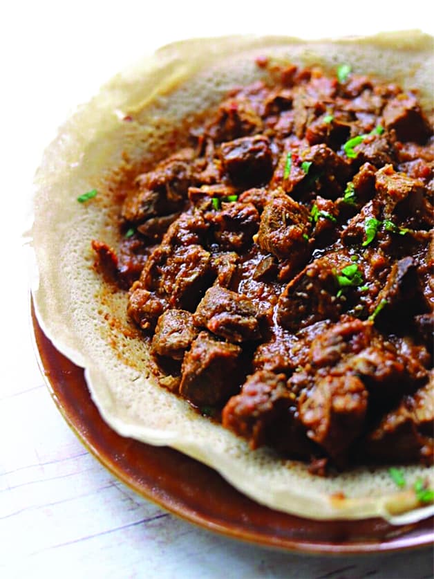 Ethiopian stew zigni on ethiopian bread.