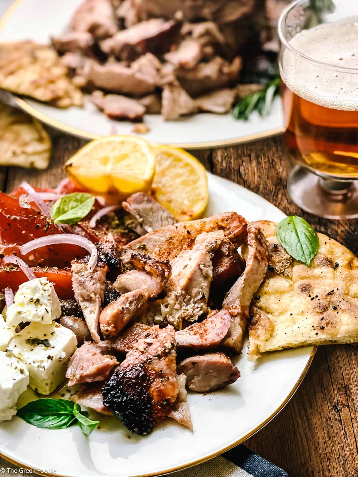 Greek gyros pita with tzatziki, sliced tomatoes, and onions — traditional Greek street food made at home