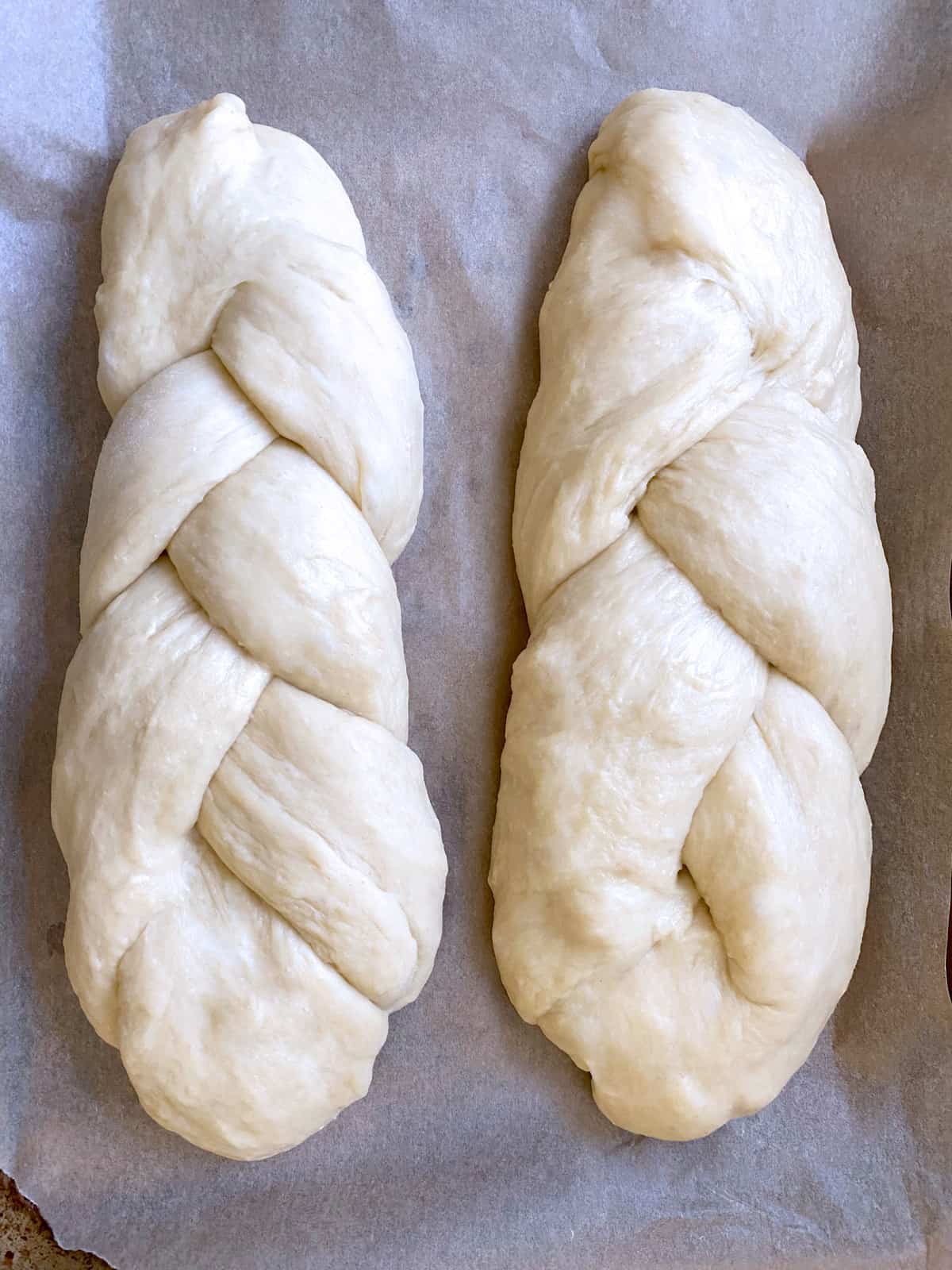 Two braided loaves of tsoureki Greek holiday bread.