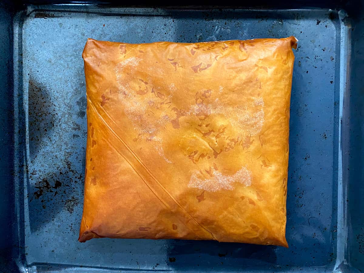 A baked bougatsa on a baking sheet.