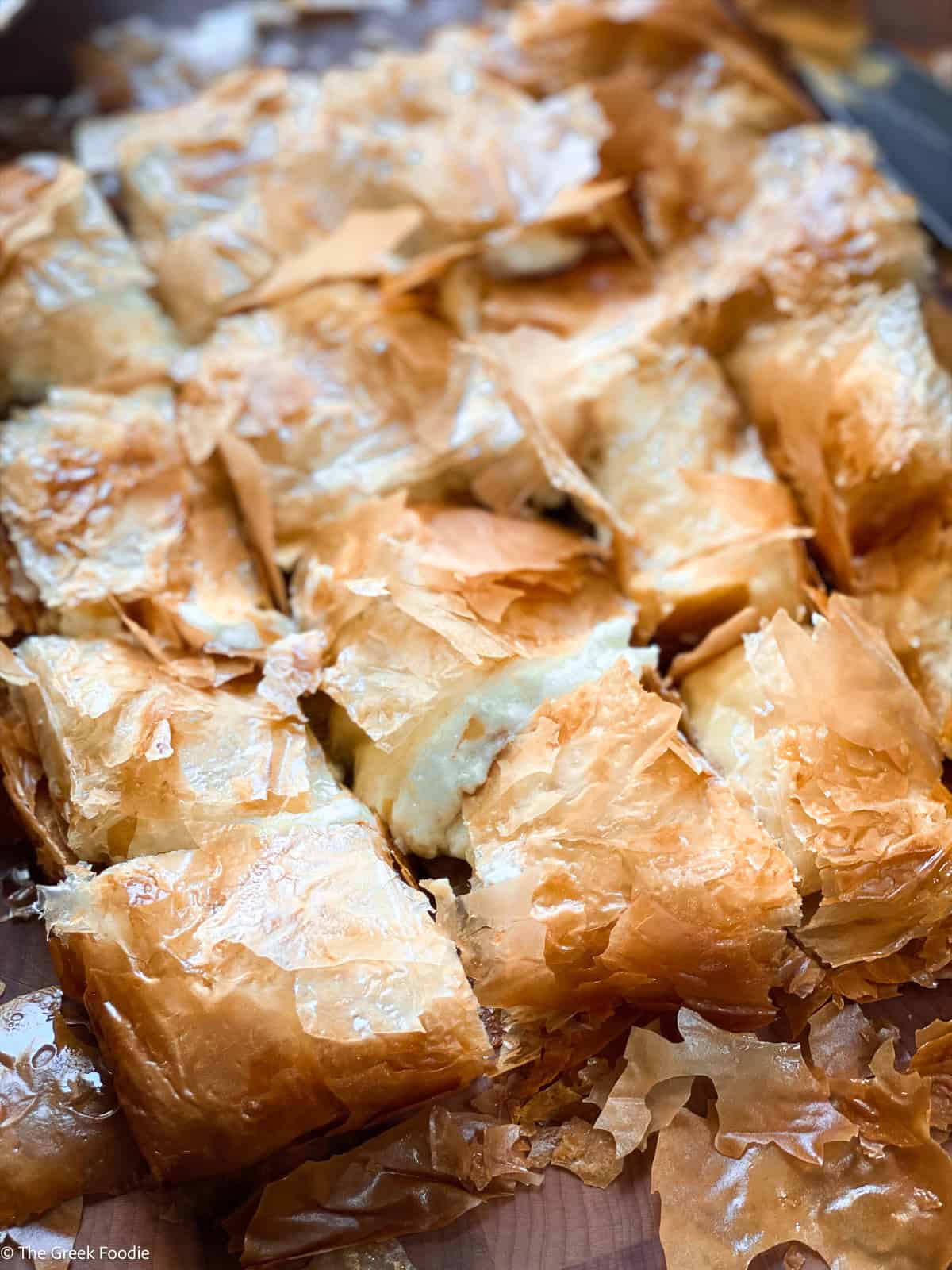 Golden baked bougatsa from Chania on a baking sheet