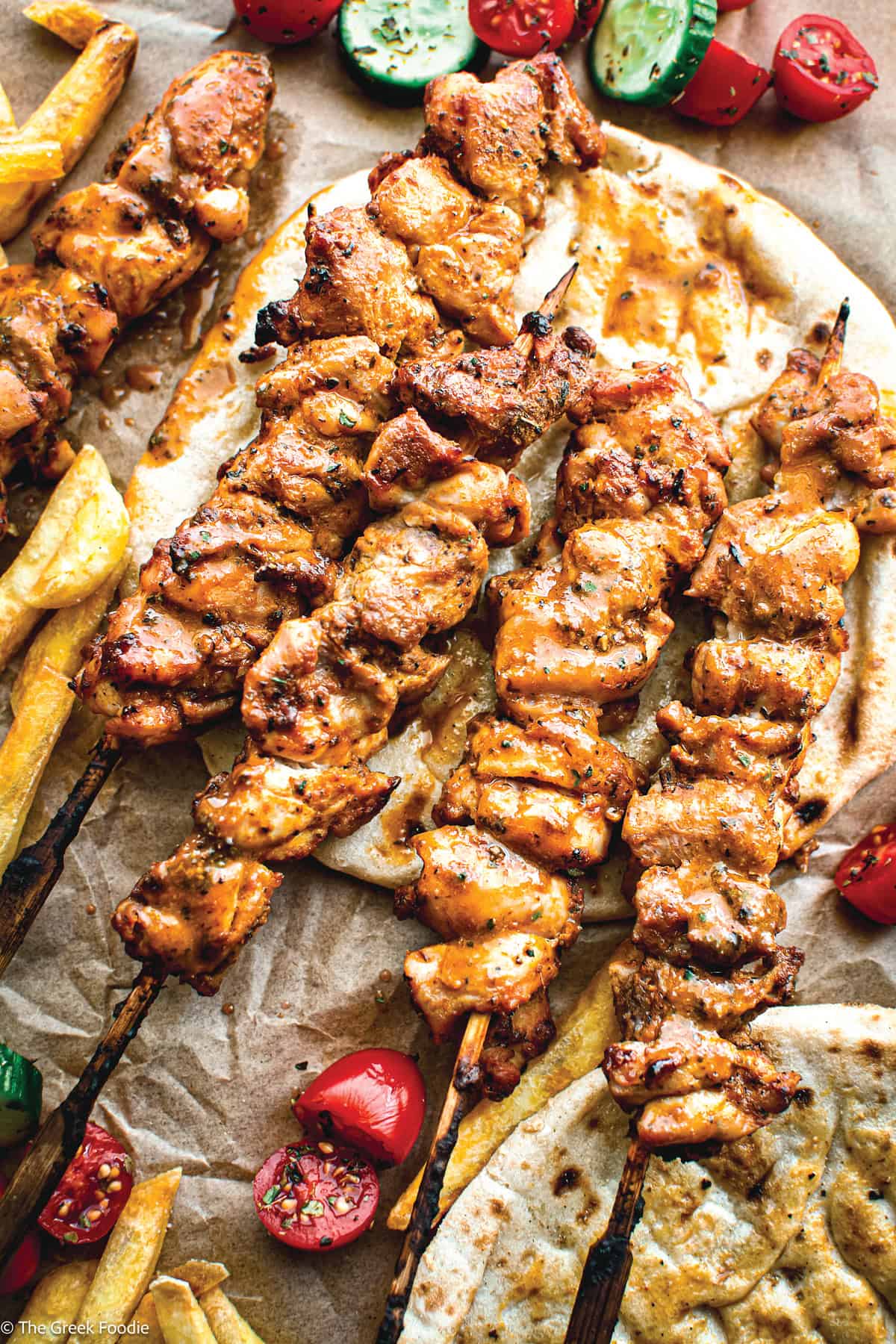 Greek chicken souvlaki Kalamaki skewers with pita and fries