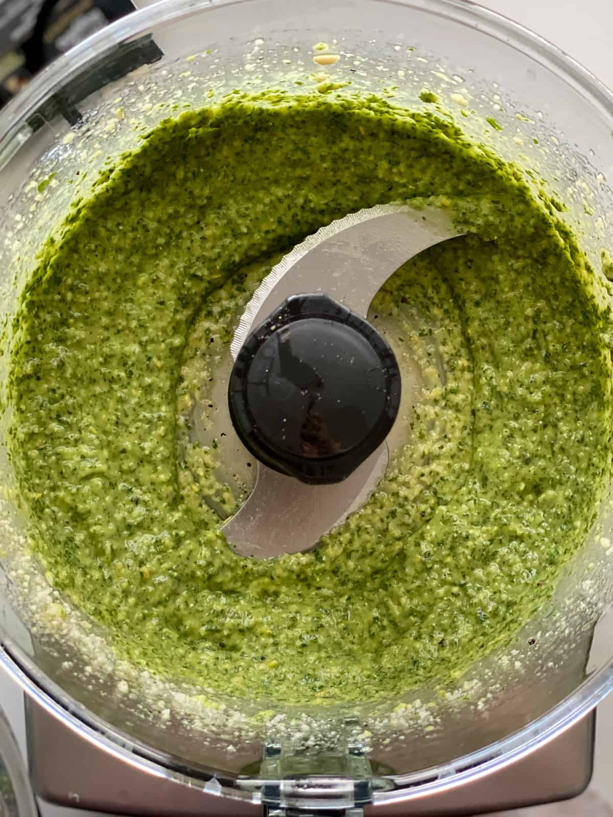 Basil pesto in a food processor.