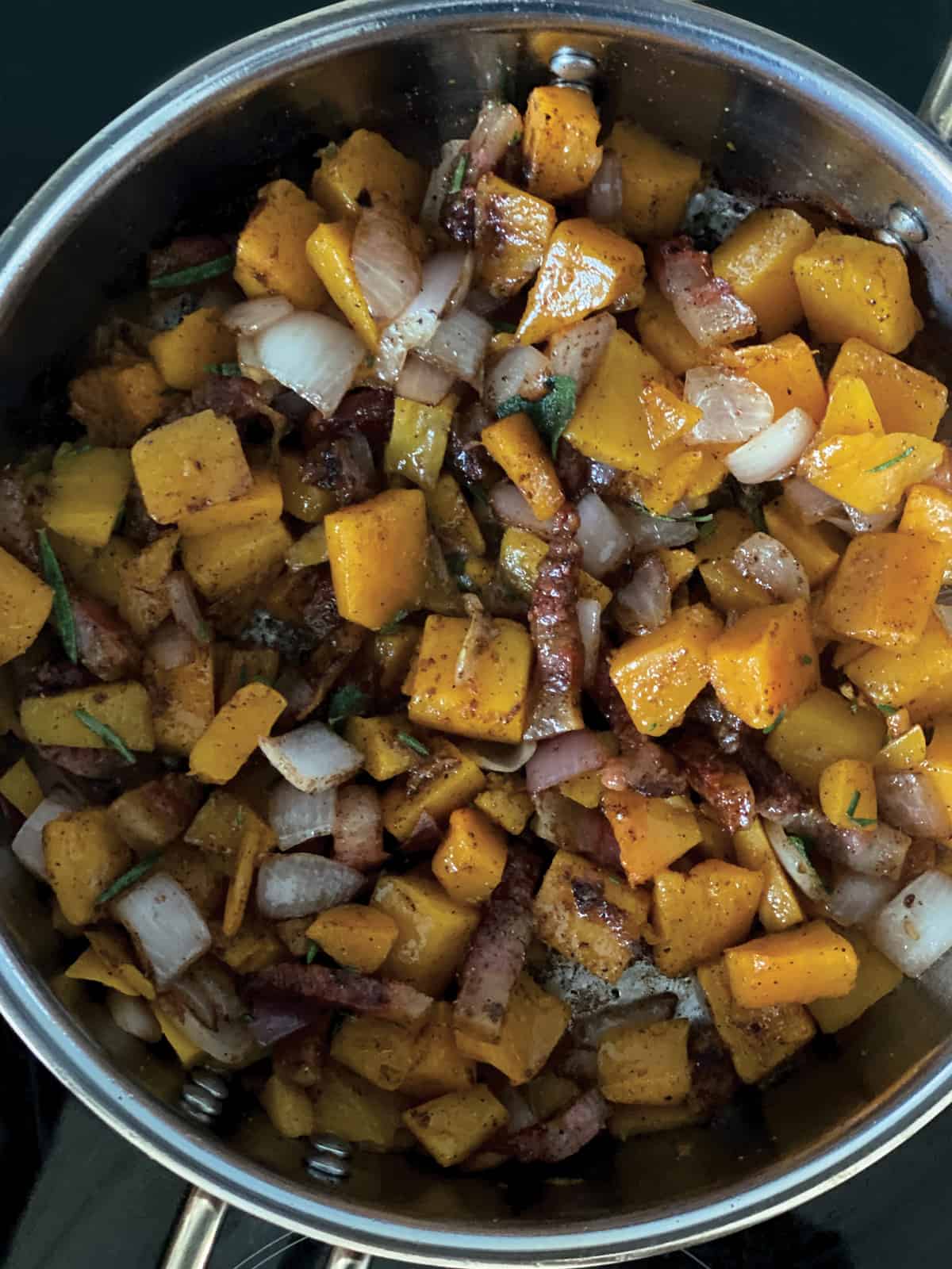 Pumpkin cubes and guanciale pieces
chopped onion and garlic in a deep sauce pan.