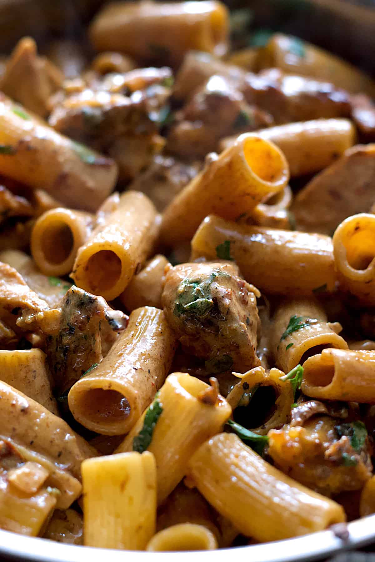 Close up of a bowl with spicy chicken chipotle pasta.