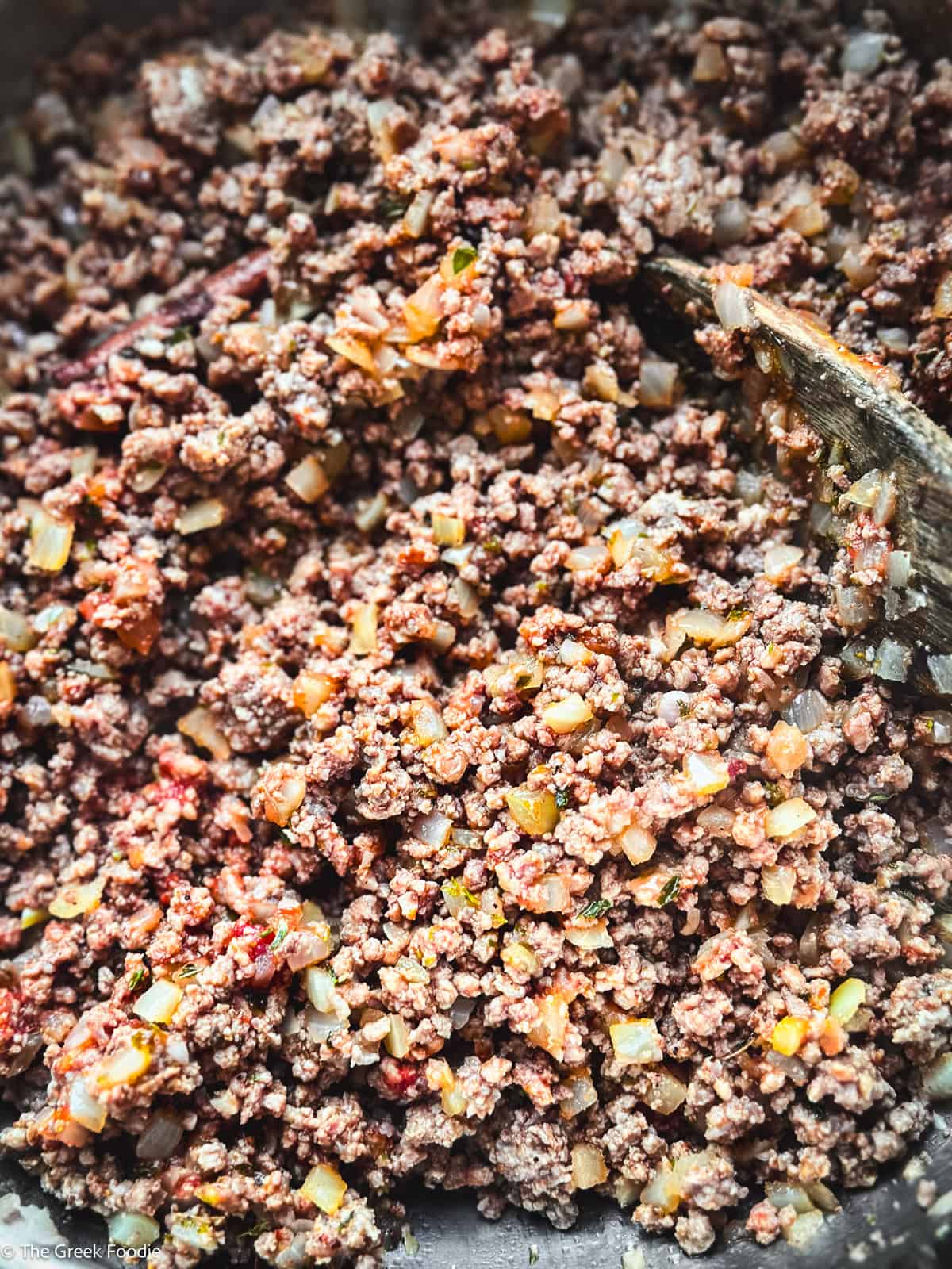Meat ragu sauce cooking for authentic Greek moussaka