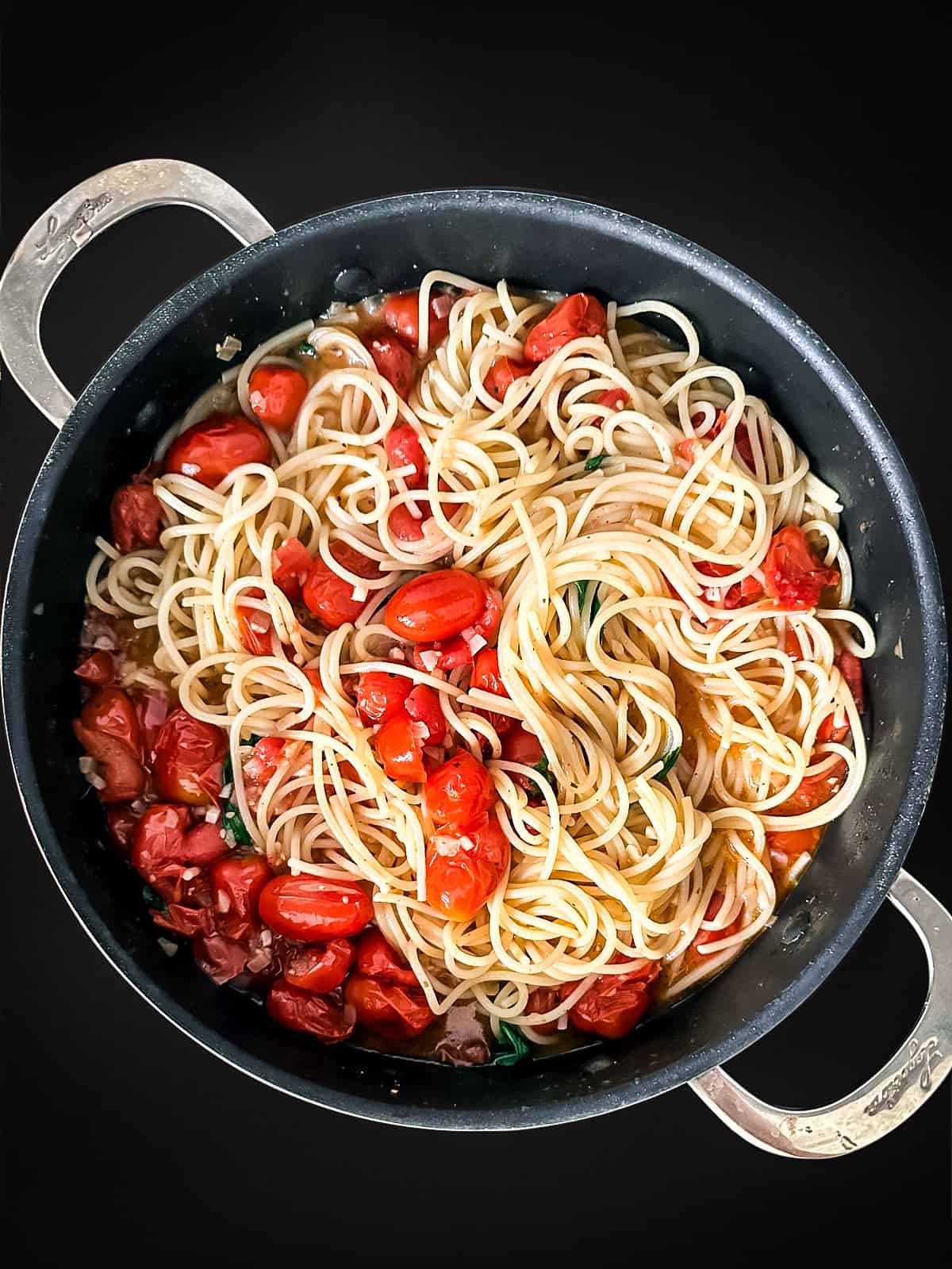 Fresh tomato pasta in a deep skillet.