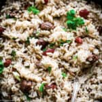 A black bowl with Greek rice pilafi-pilaf on a table.