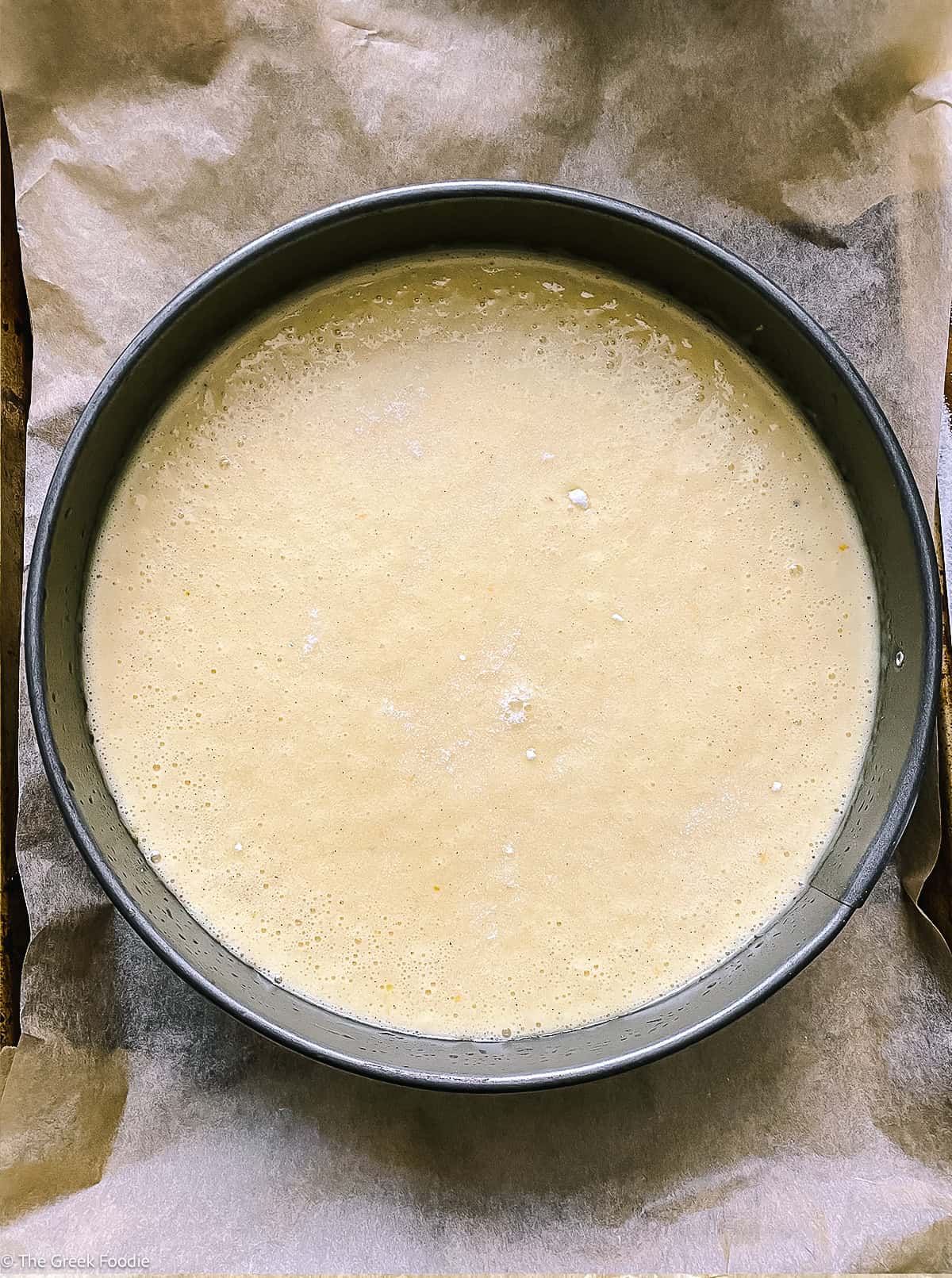 A cake pan with cake batter in it.