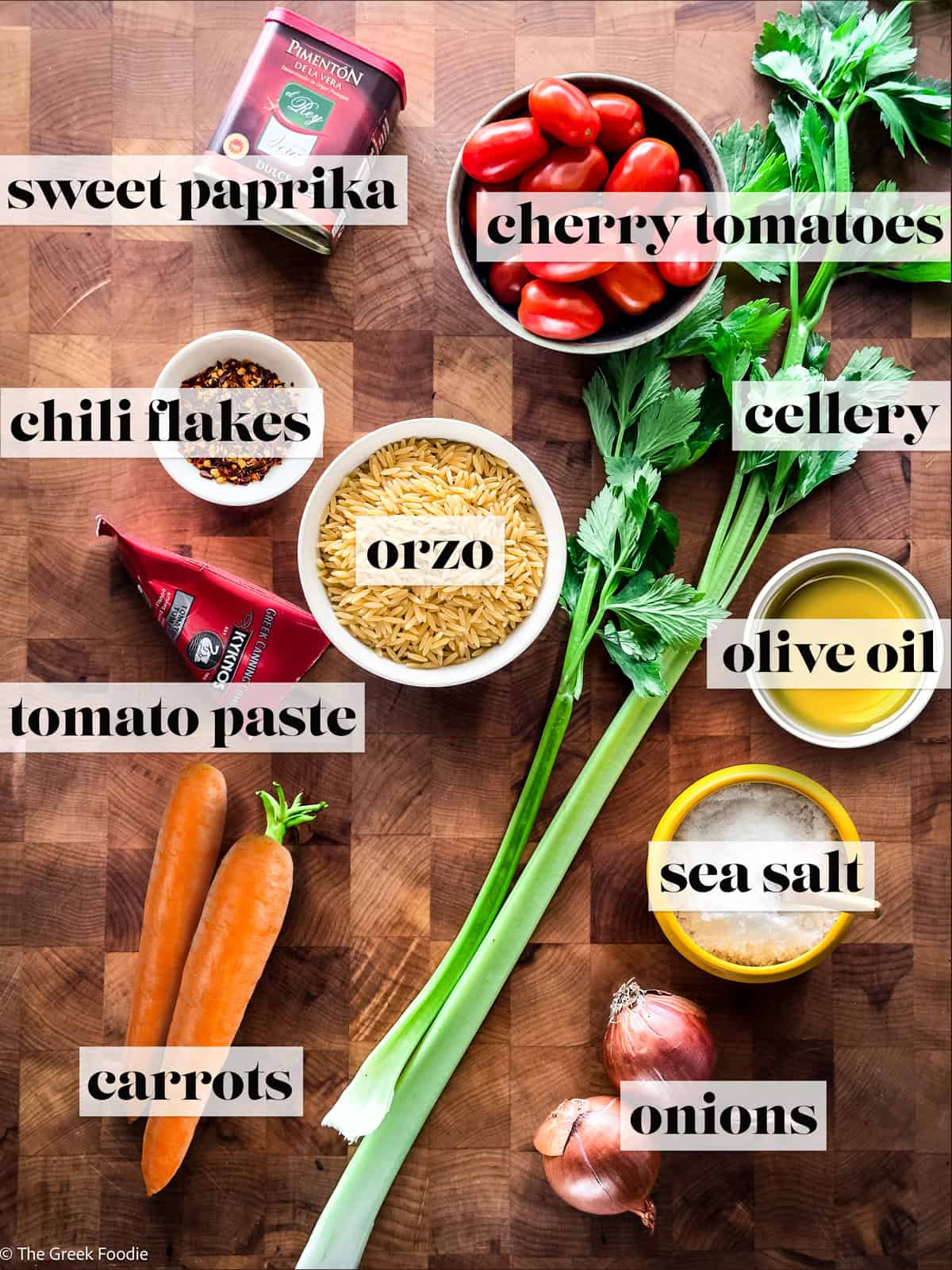 Ingredients for making mantra recipe with orzo, tomatoes, onions, celery and olive oil.