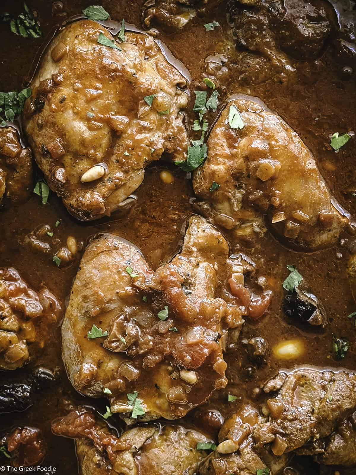 Greek chicken kapamas in wine sauce.