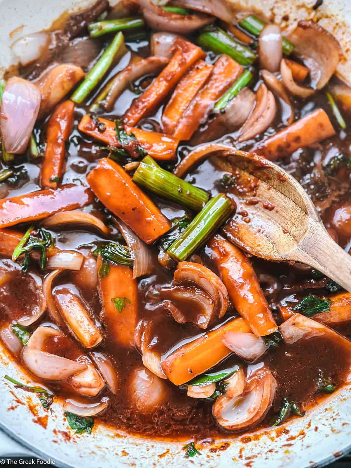Onion, celery, and carrots , tomato paste and wine in olive oil in a pan.