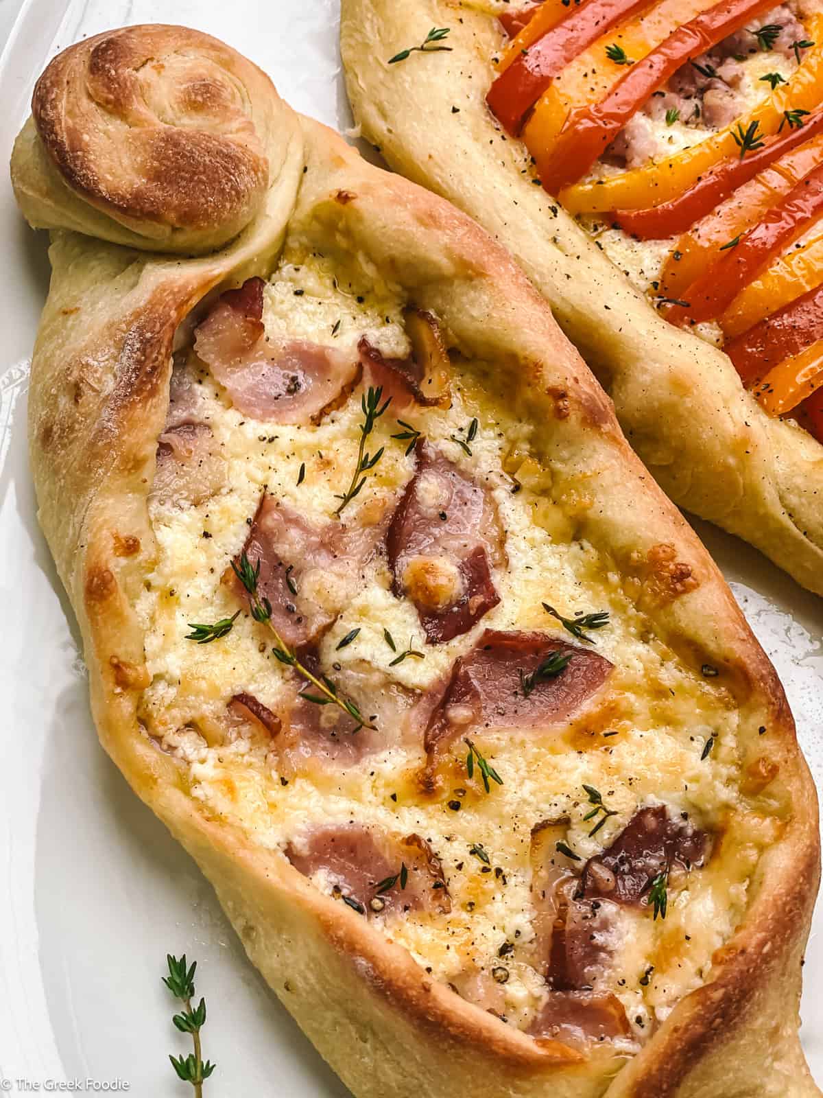 Peinirli, Greek pizza boat on a platter.