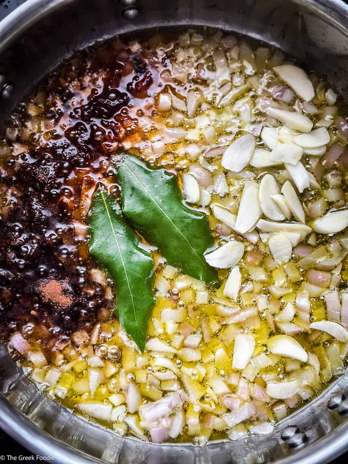 Chopped onions in olive oil, cooking.