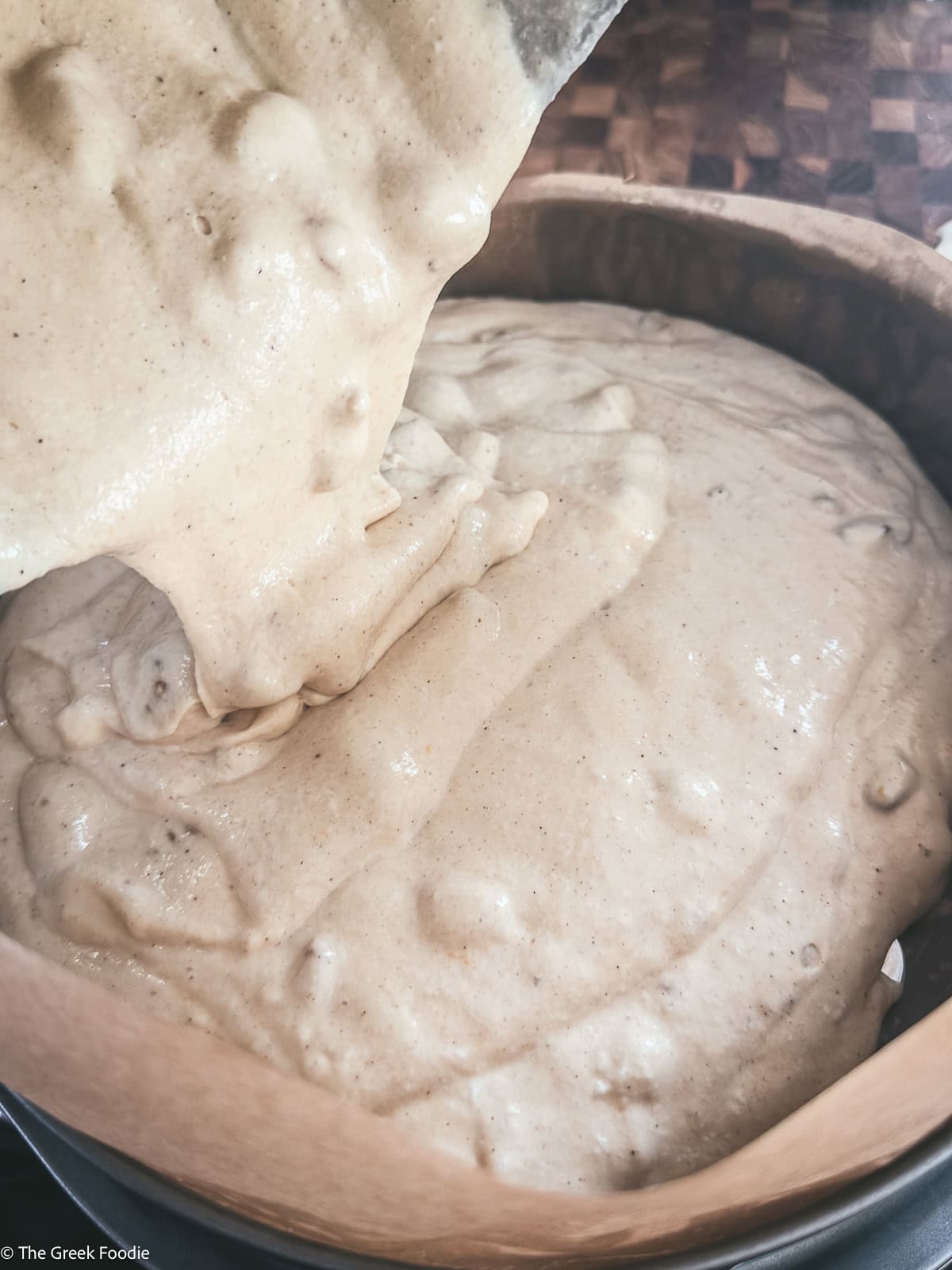 Cake batter poured into a cake pan.