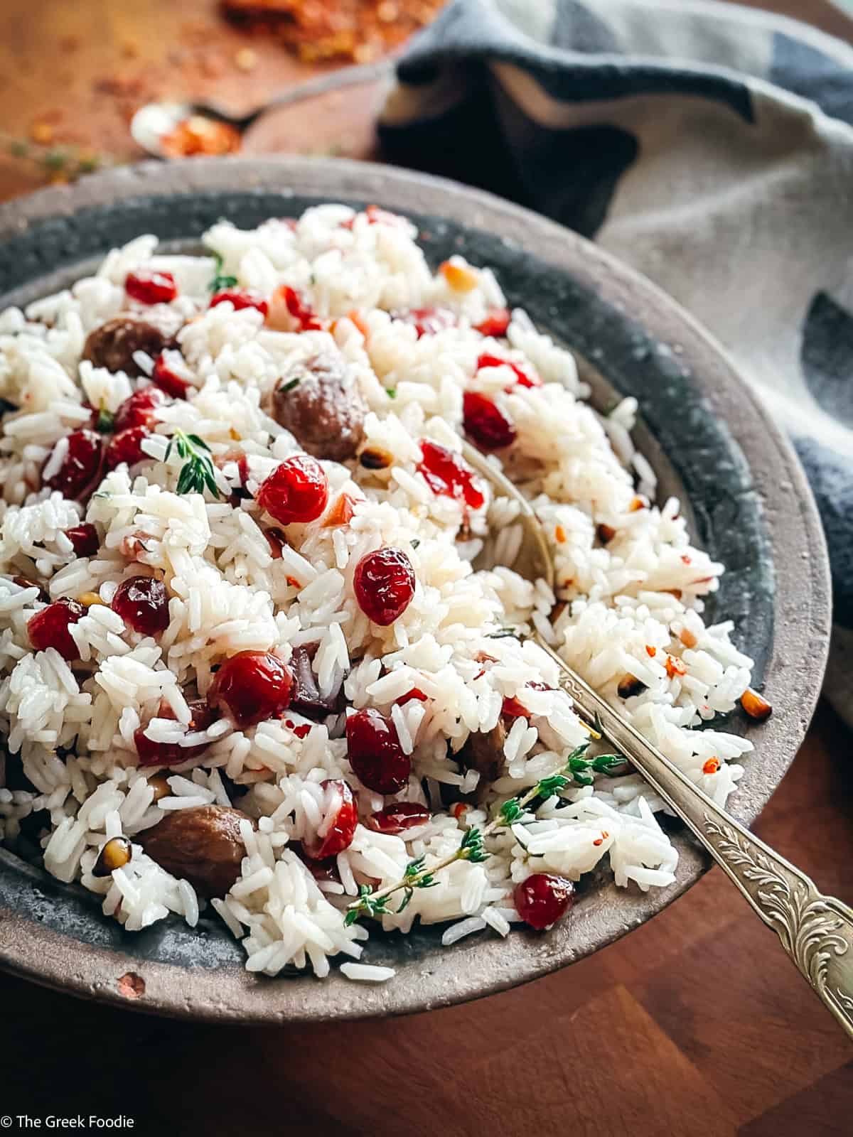 A plate with Greek rice pilaf-pilaf on a table.