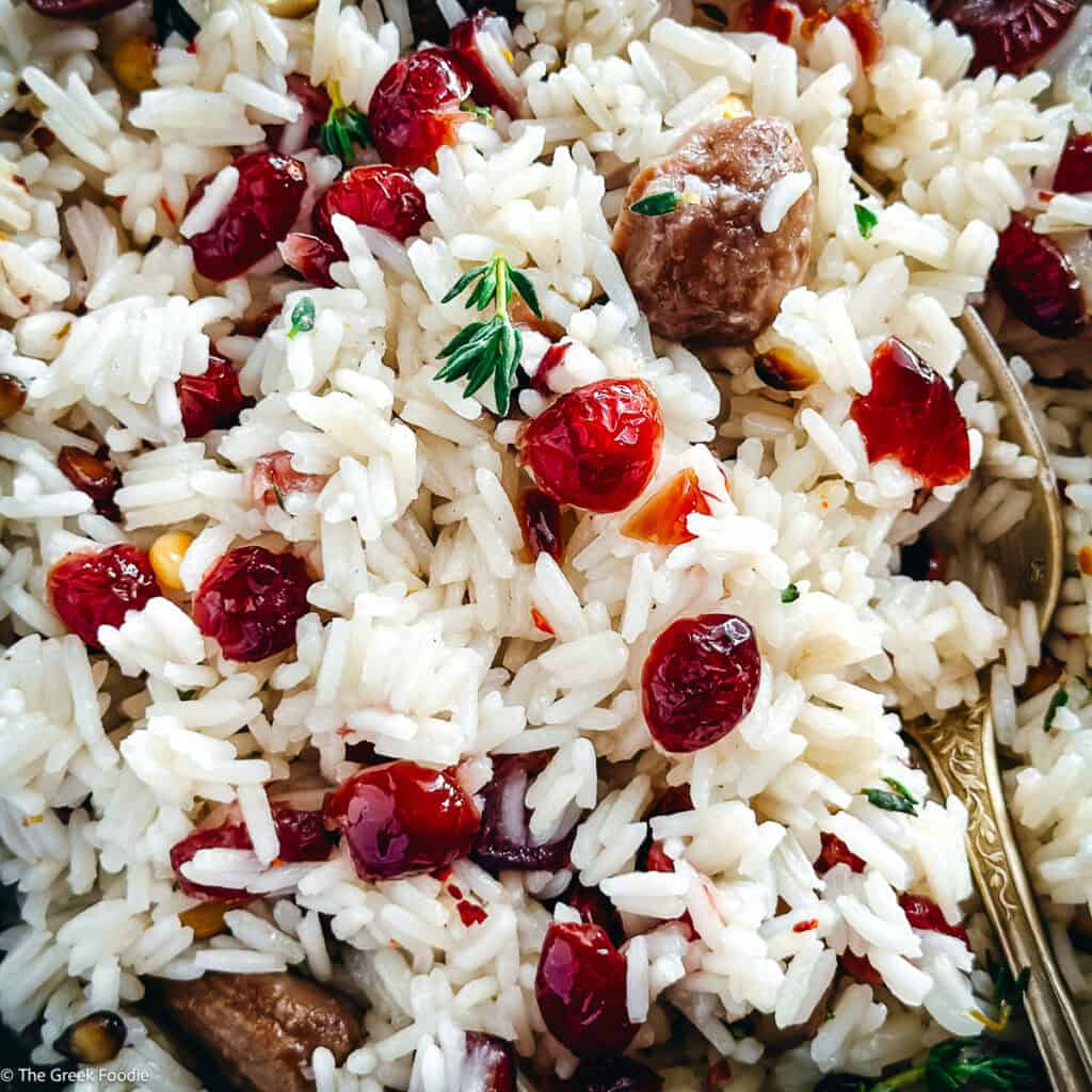 A plate with Greek rice pilaf-pilafi on a table.