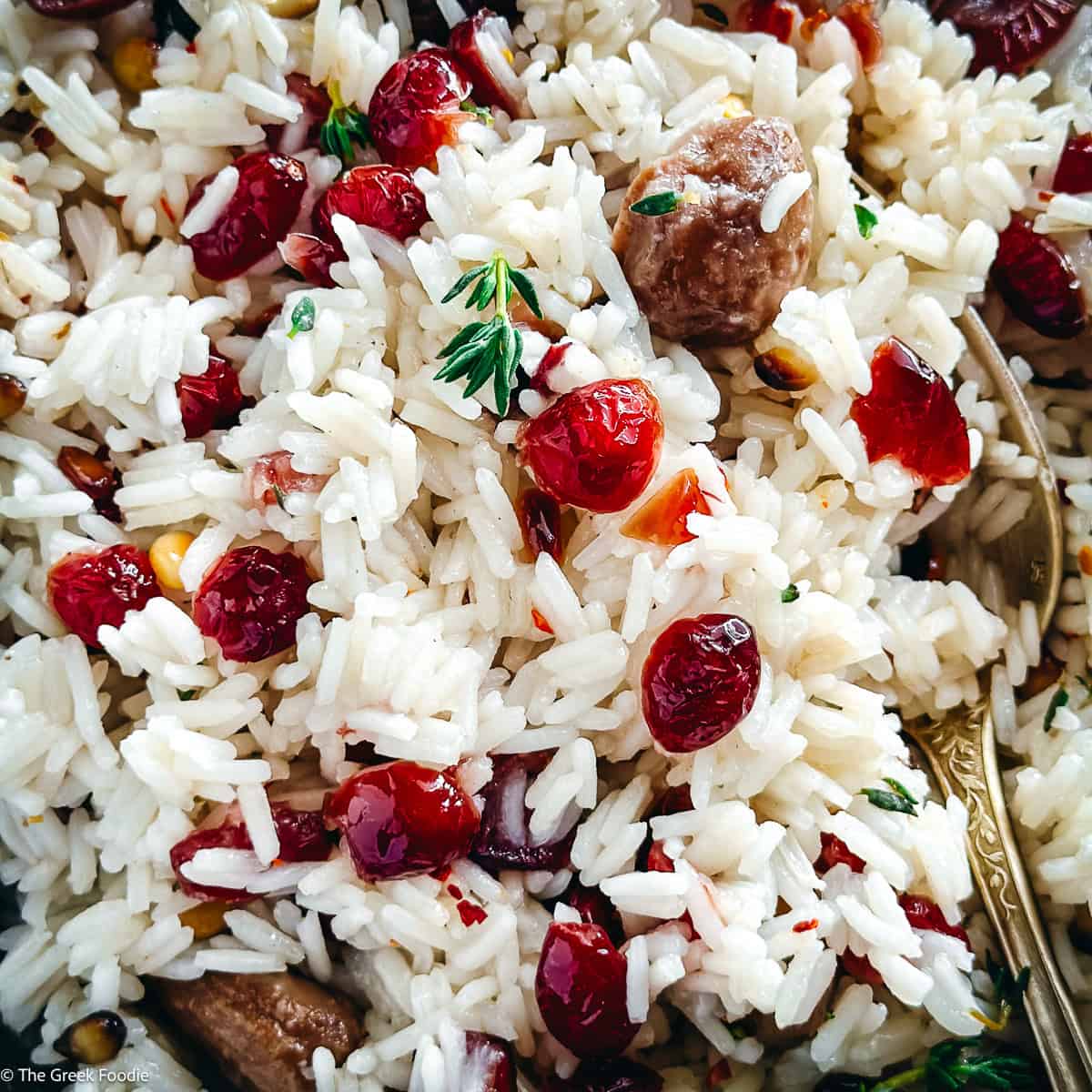 A plate with Greek rice pilaf-pilafi on a table.