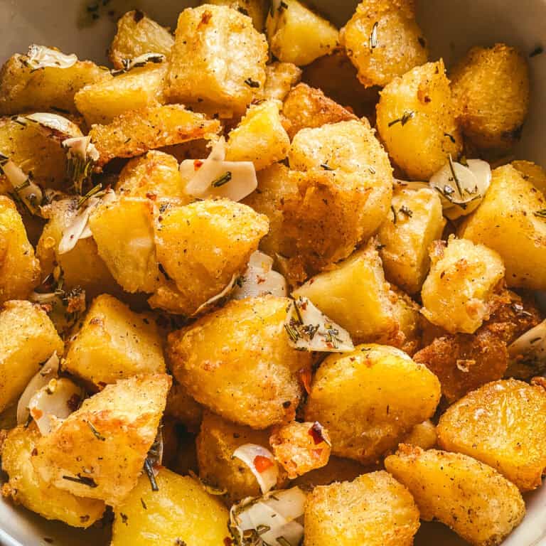 Rosemary potatoes with parmesan in a bowl.