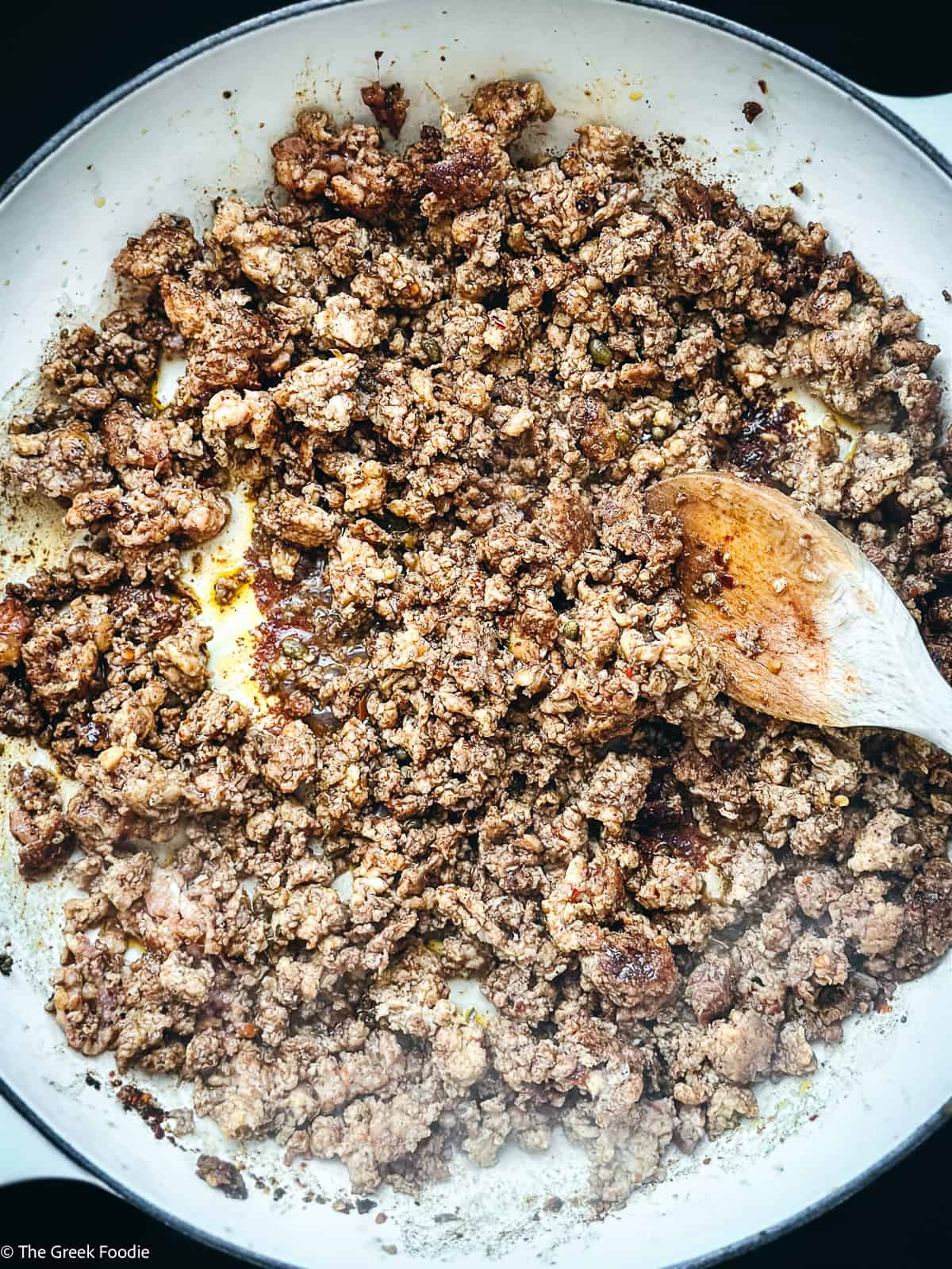 Ground chicken browning in a pot.