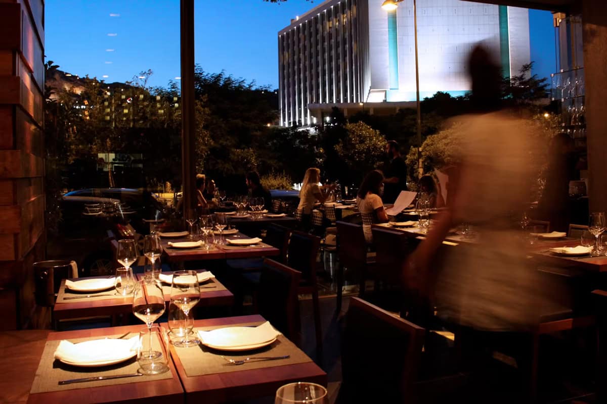 The restaurant Vezene in Athens, view from the interior towards outside view of the Hilton/Conrad hotel.