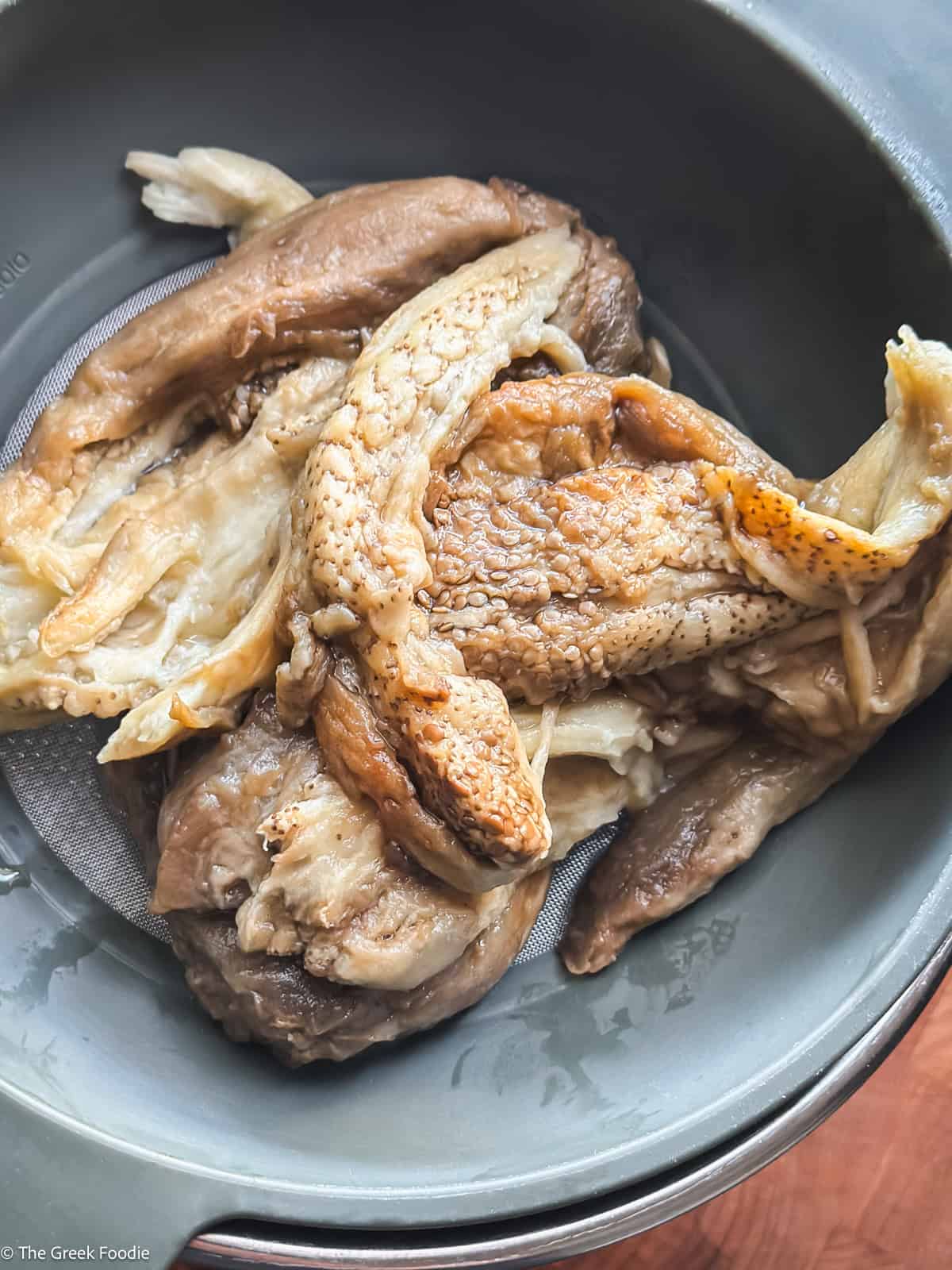 Eggplant flesh in a colander.