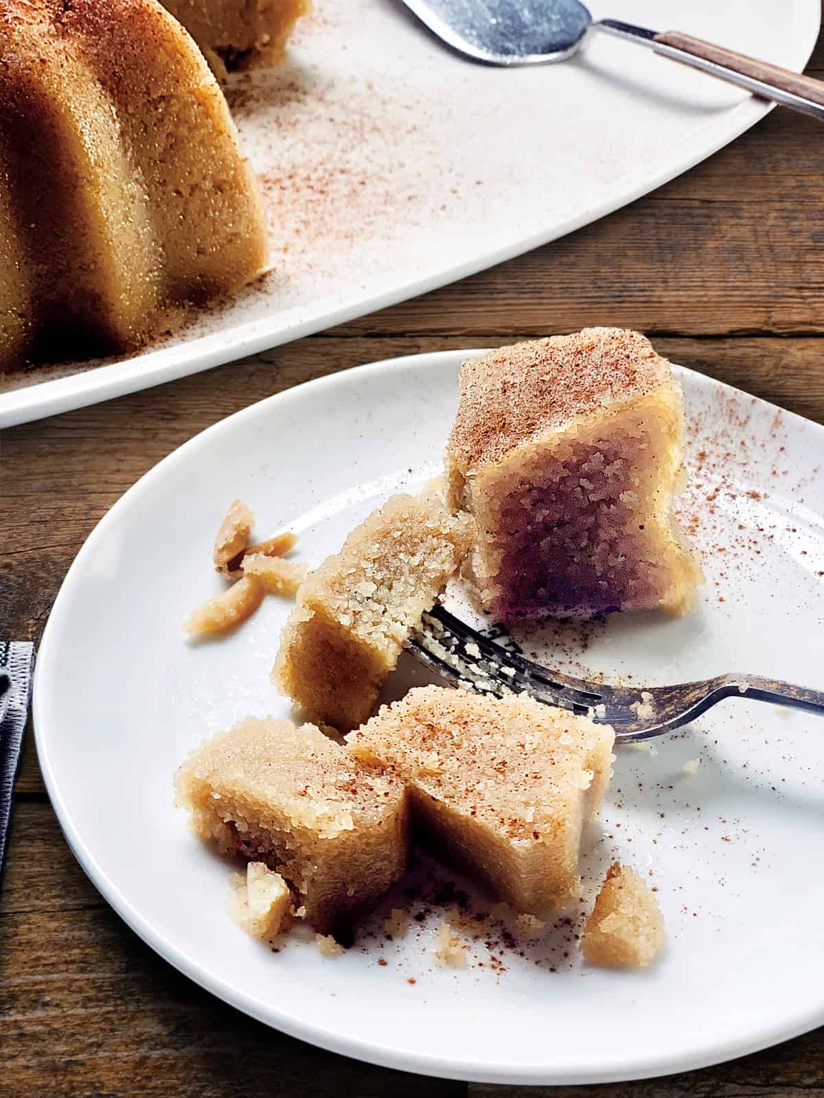 A piece of halve cake on a plate.