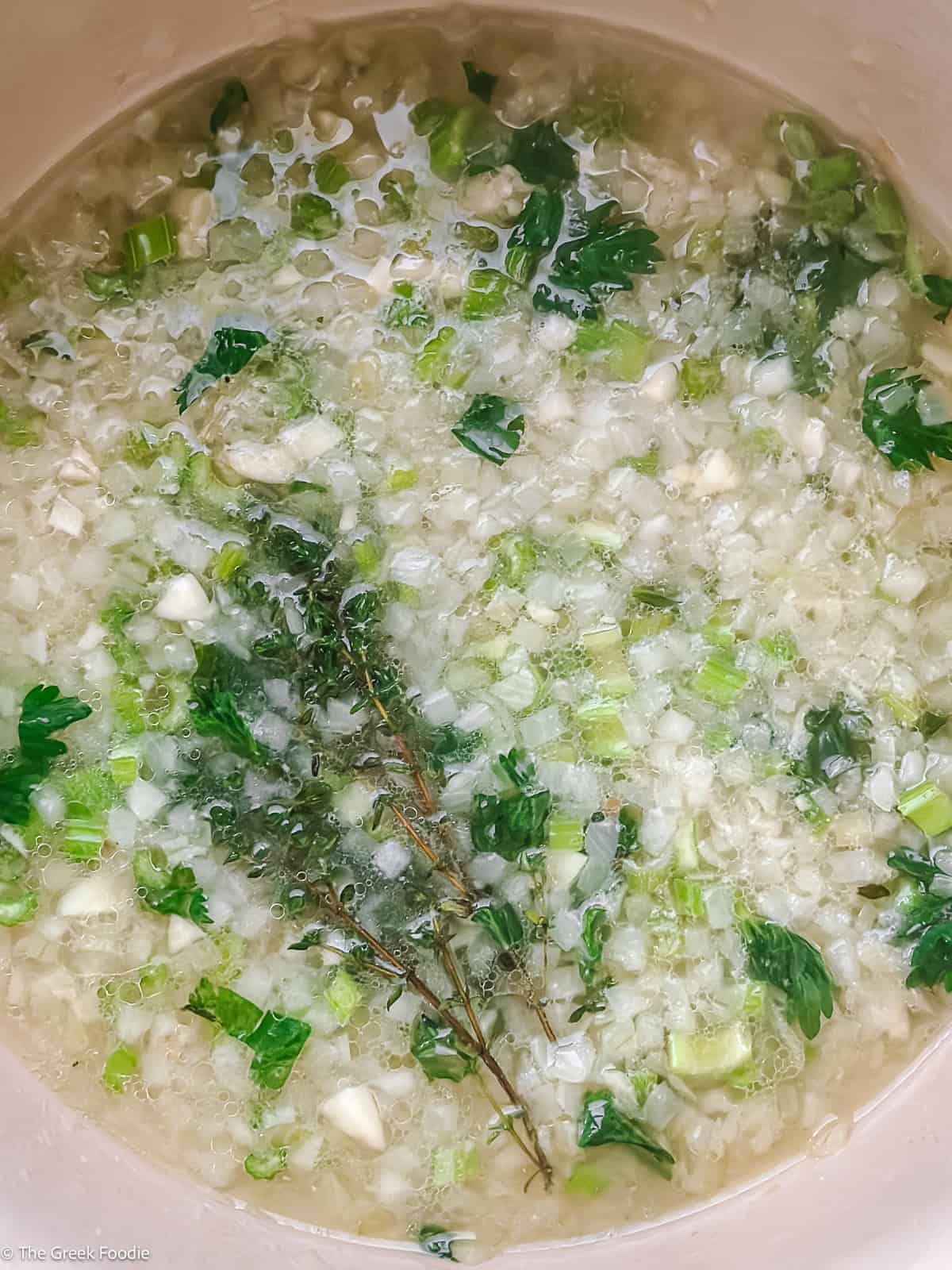 Onion, celery and white wine base simmering for Greek mushroom magiritsa