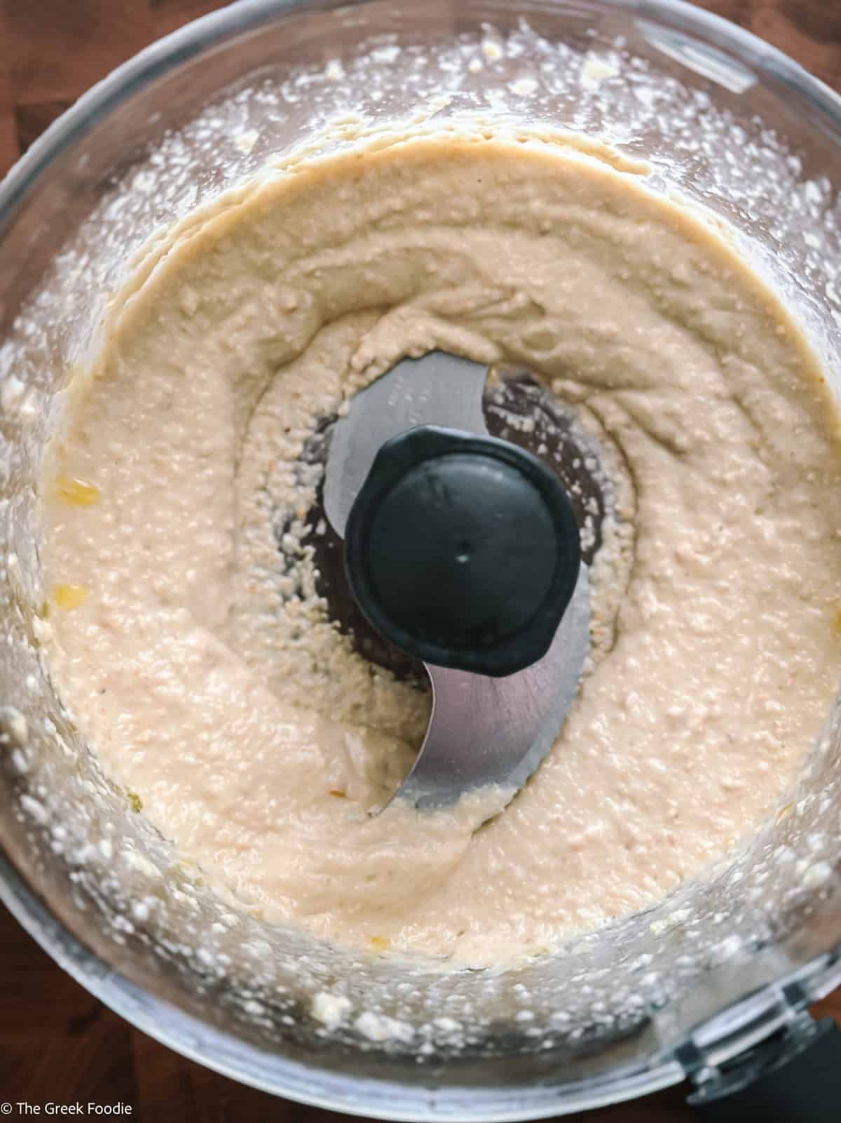 Creamy almond skordalia blended smooth in a food processor.