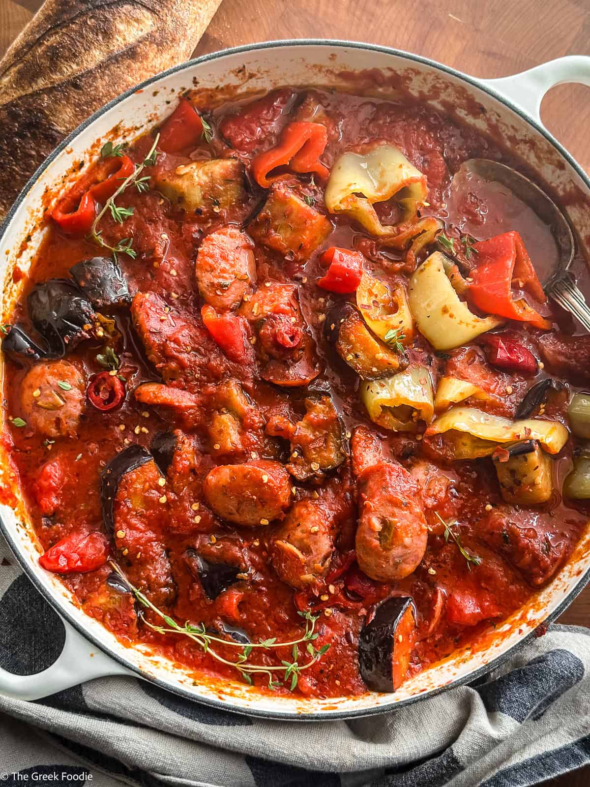 Spicy Greek spetzofai with loukaniko sausage, Florina peppers, and rich tomato sauce