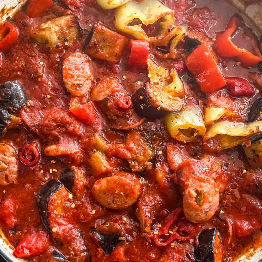 Spicy Greek spetzofai with loukaniko sausage, Florina peppers, and rich tomato sauce