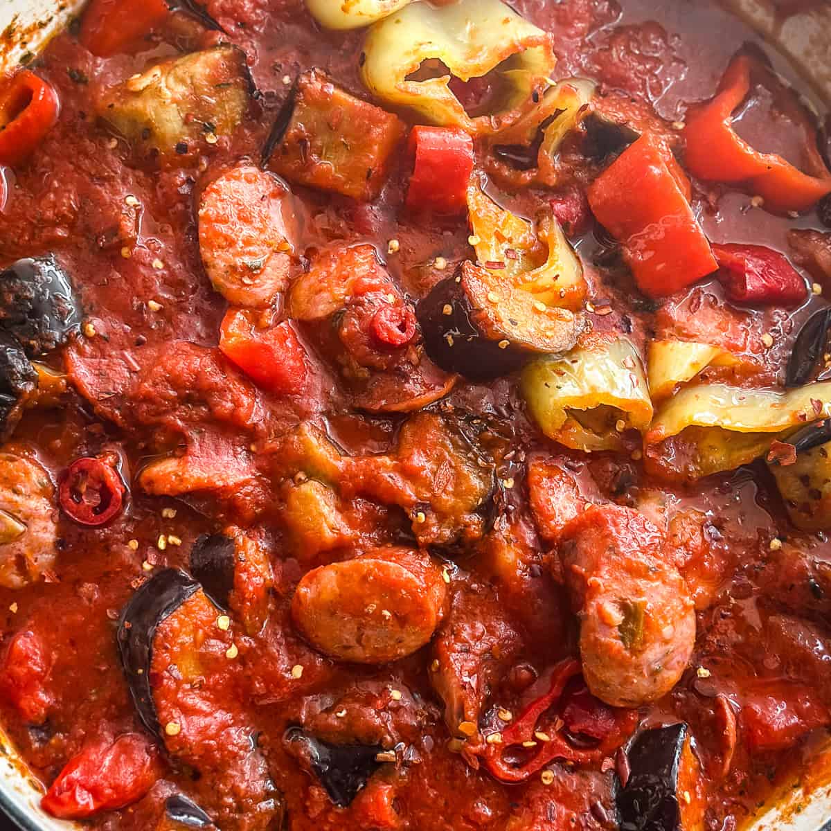 Spicy Greek spetzofai with loukaniko sausage, Florina peppers, and rich tomato sauce