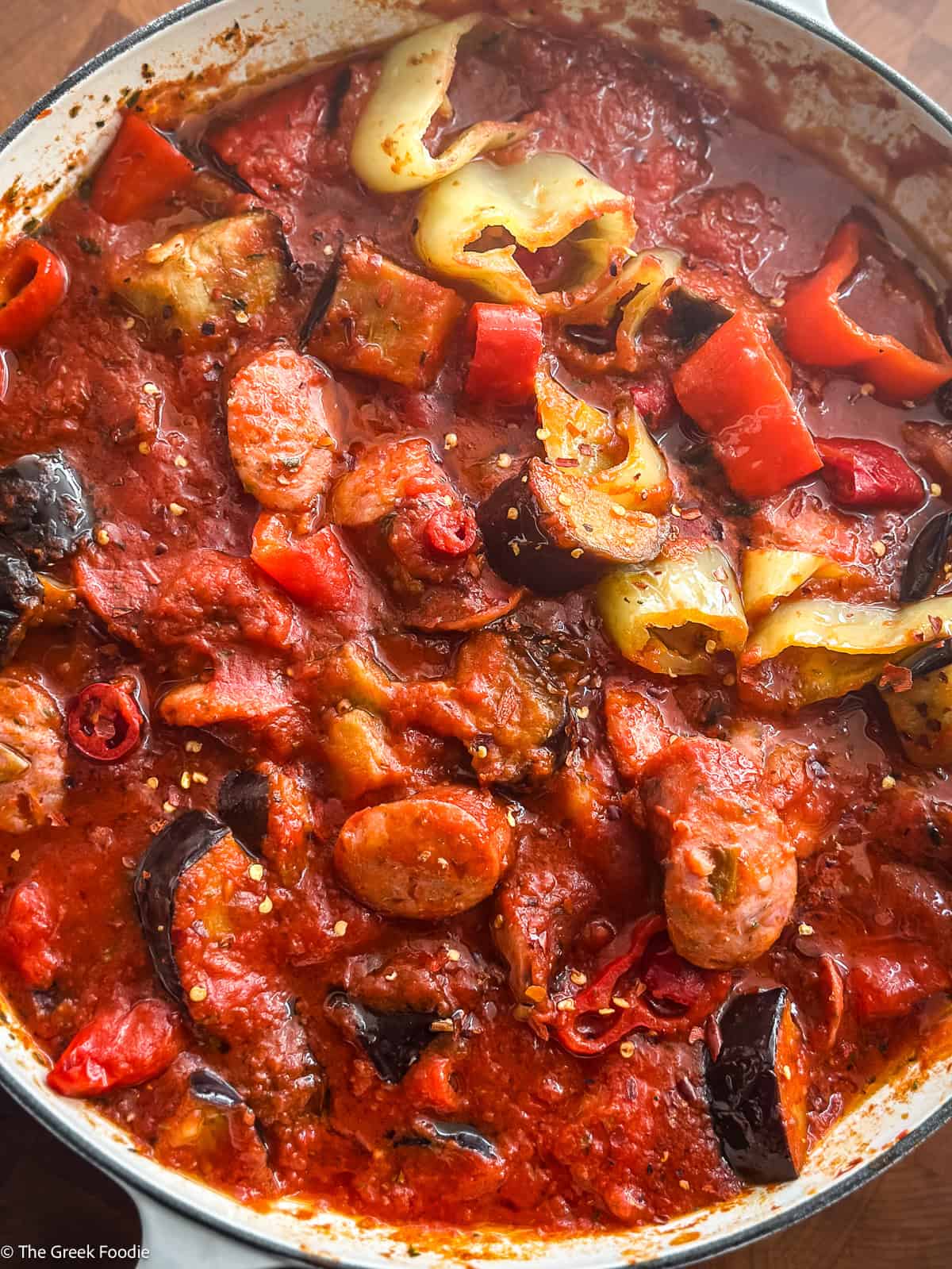 Spicy Greek spetzofai with loukaniko sausage, Florina peppers, and rich tomato sauce
