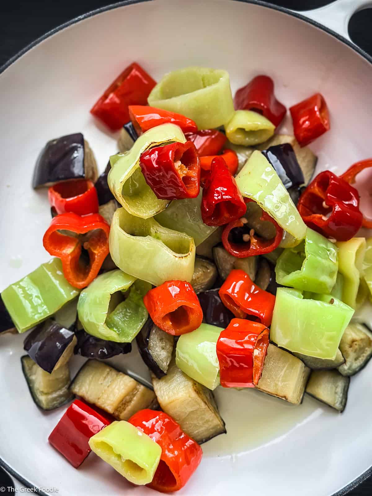 Fried peppers and eggplant ready to go into the pot for spetzofai Greek sausage stew