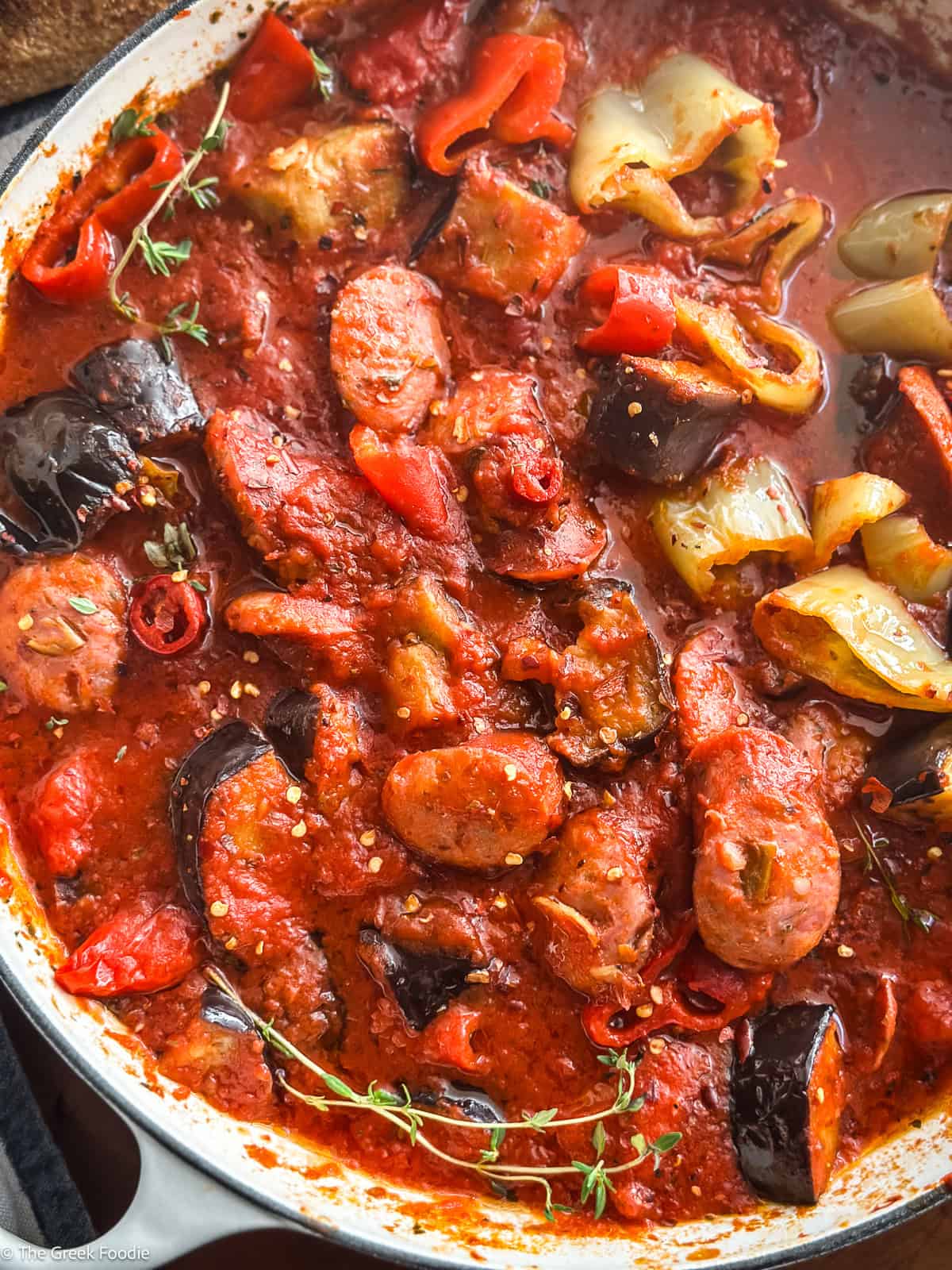 Spicy Greek spetzofai with loukaniko sausage, Florina peppers, and rich tomato sauce