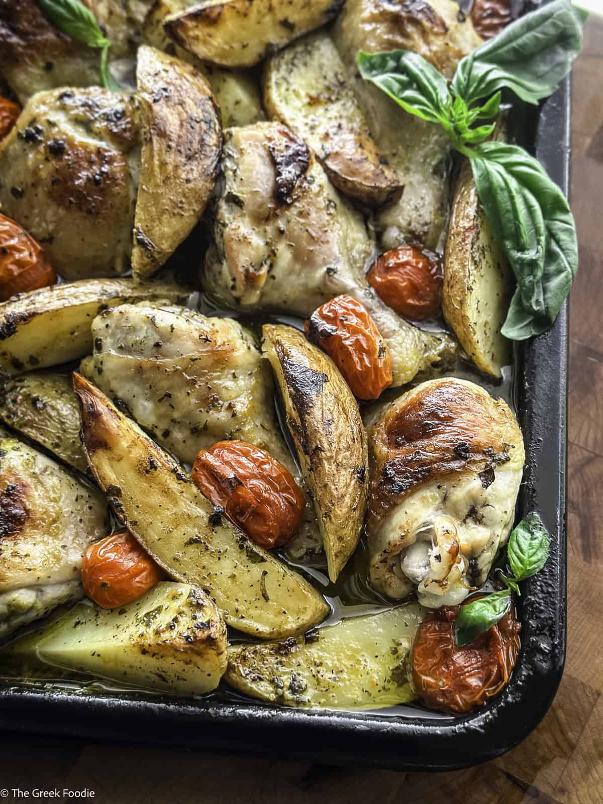 Chicken and potatoes cooked in one pan with orange and lemon marinade