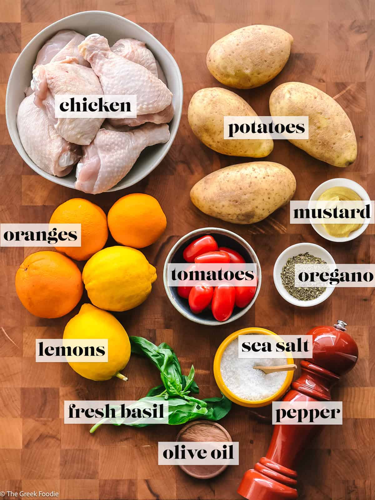 Ingredients gathered to make chicken and potatoes with an orange lemon marinade.